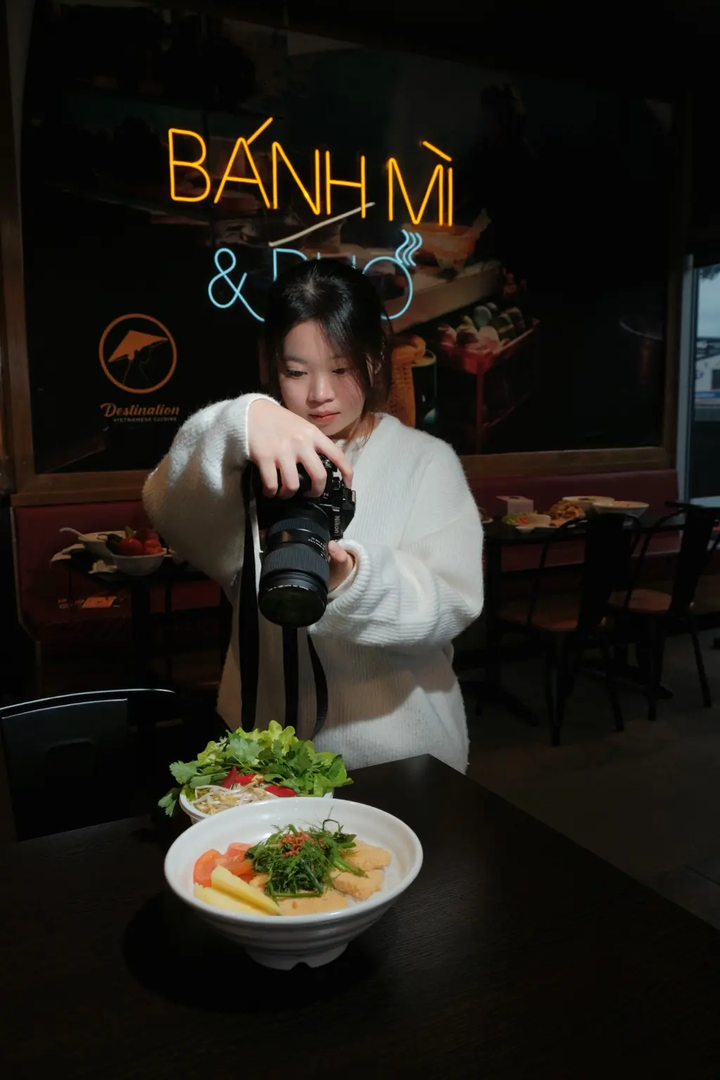 Hailey Nguyen holding her camera