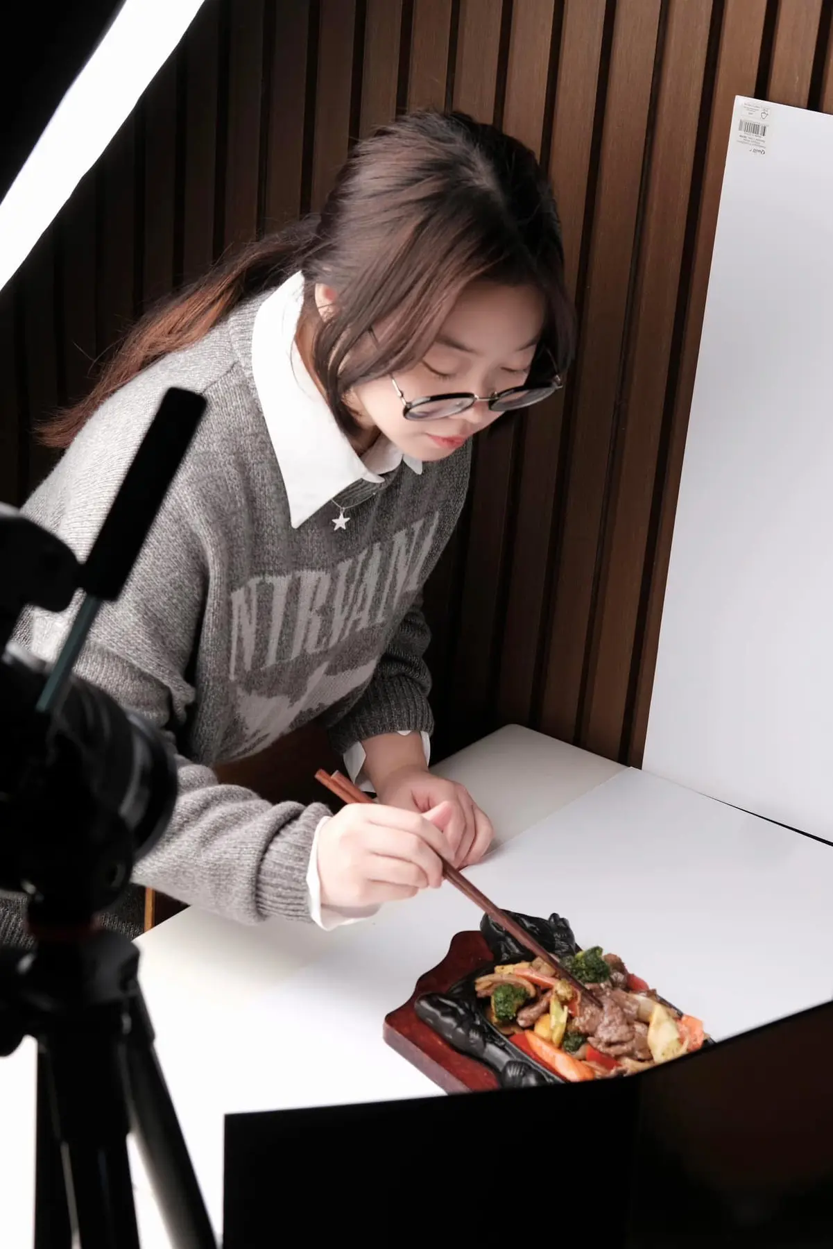 Hailey Nguyen styling food on set